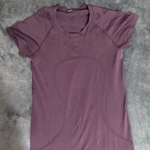 lululemon short sleeve shirt in a plum purple. only worn a few times